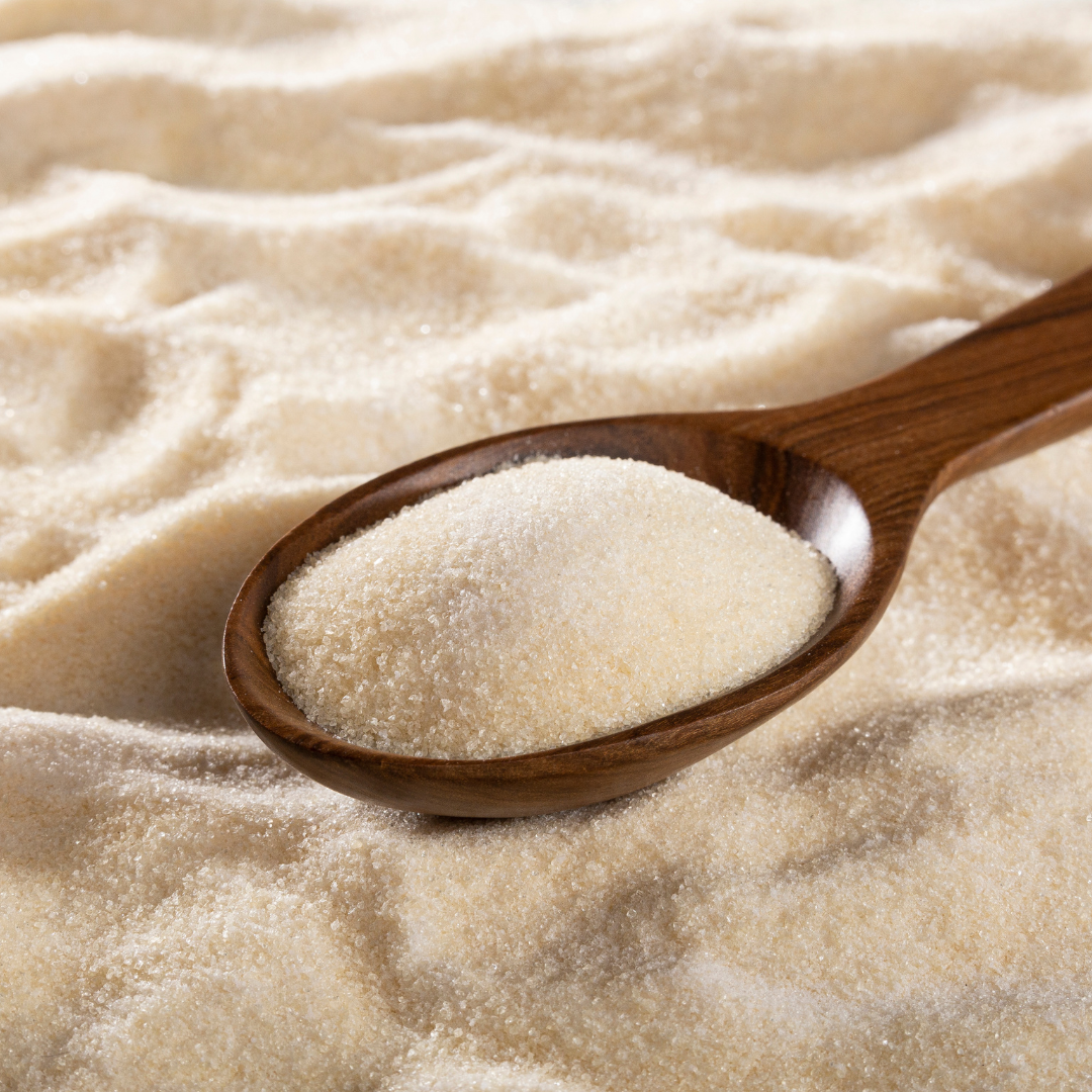 Image of vegan collagen and plant peptides background with some on a wooden spoon