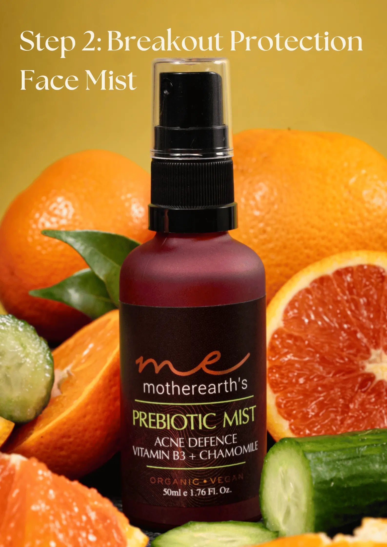 An image of MotherEarth's Prebiotic Mist in a background of cut oranges and cucumbers. Overlay text says "Step 2: Breakout Protection Face Mist"